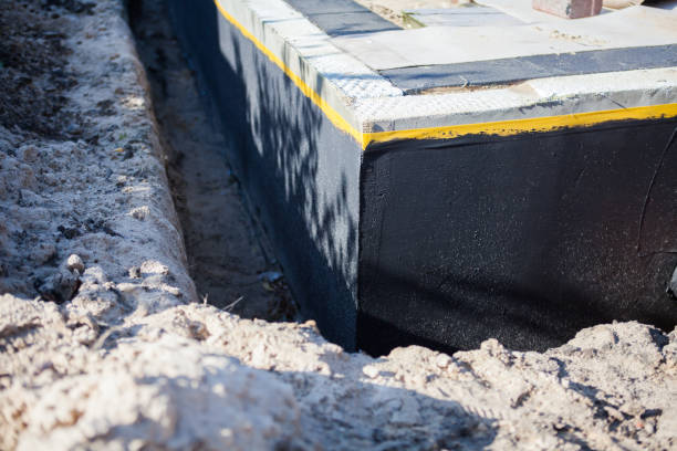 Professional Basement Waterproofing technician working in Greenwich, OH